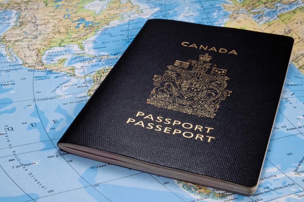 A Canadian passport placed on a world map
